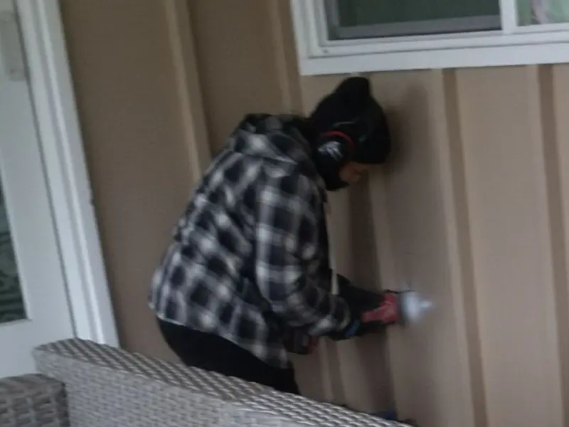 Professional electrician installing an exterior outlet in Pittsfield