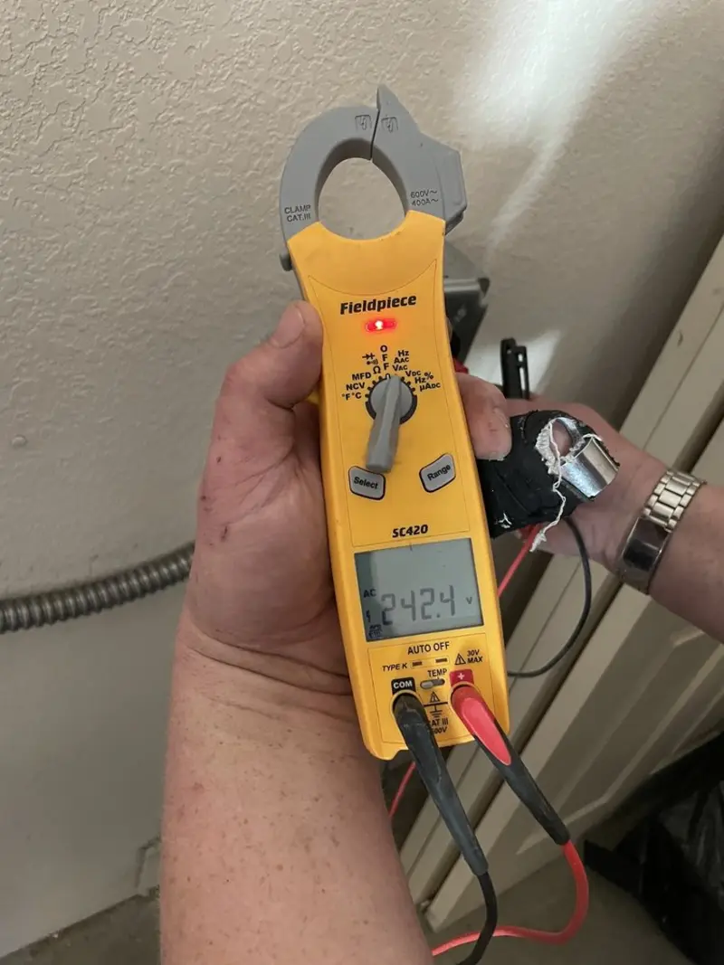 Voltage testing with clamp meter during Whole House Surge Protector in Pittsfield